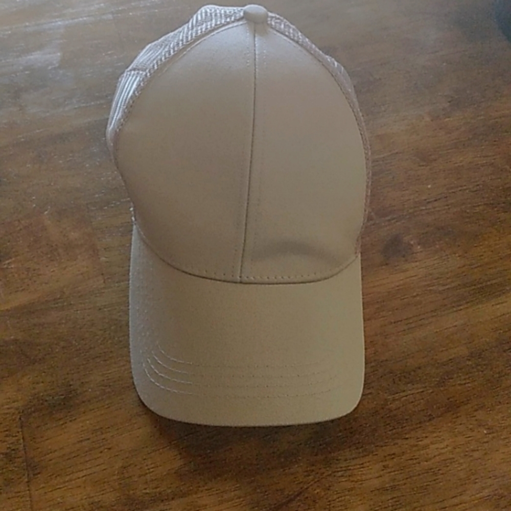 Tan baseball cap with ponytail hole